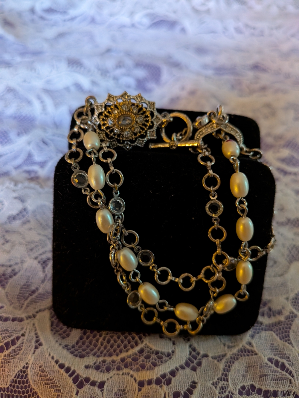 Silver-Tone Multi-Strand Pearl Bracelet with Decorative Clasp - Cream Pearls